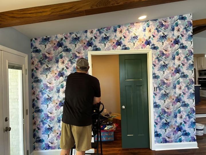 Decorative floral feature wall being installed in a residential interior